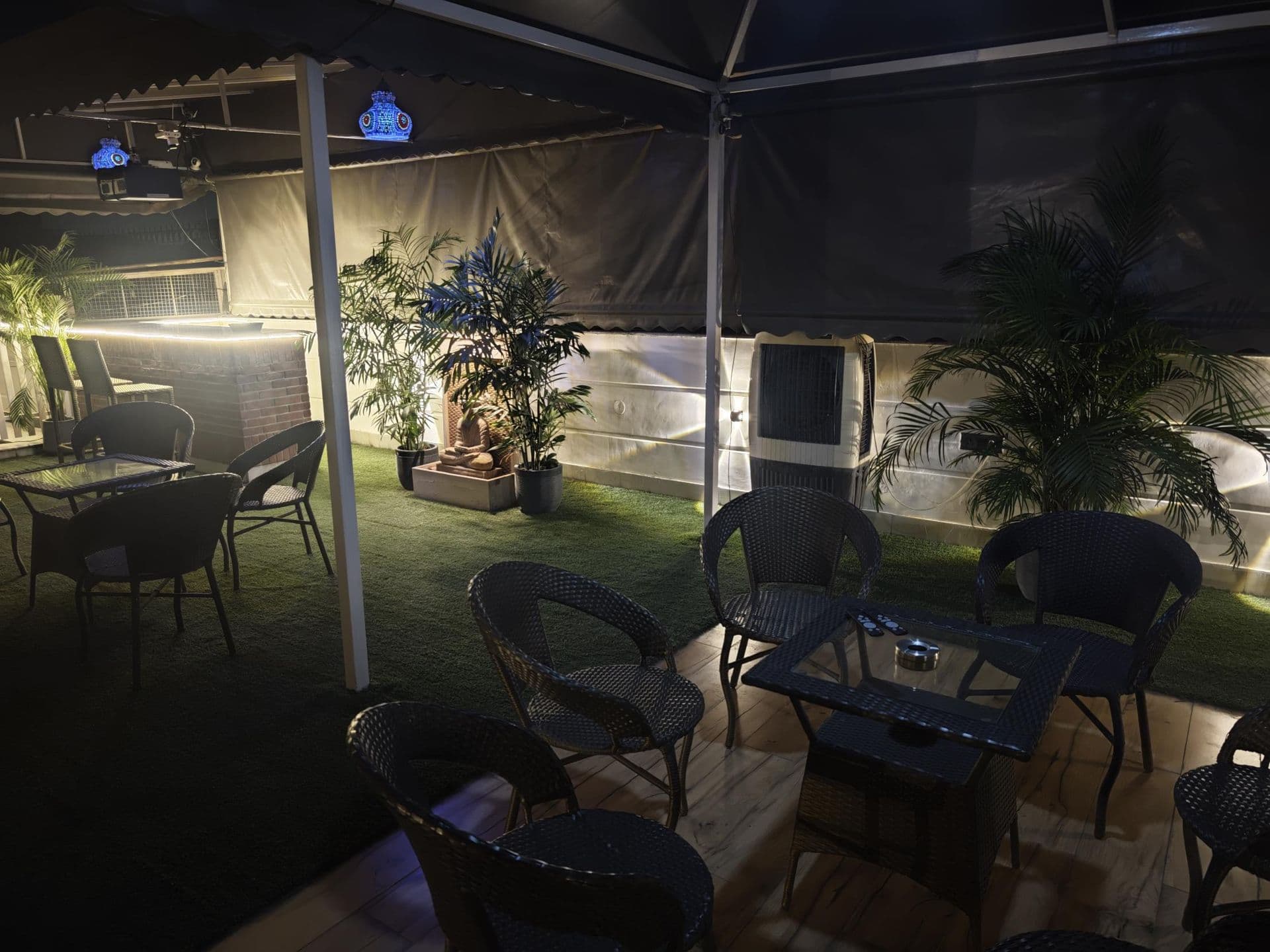The bar, white picket fence and awning on the terrace